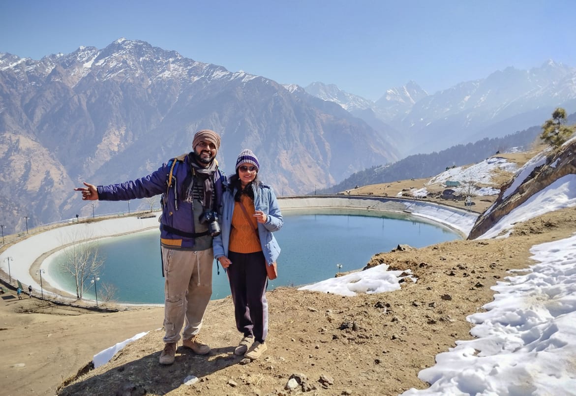 Travellers at Auli lake with Himalayan peaks