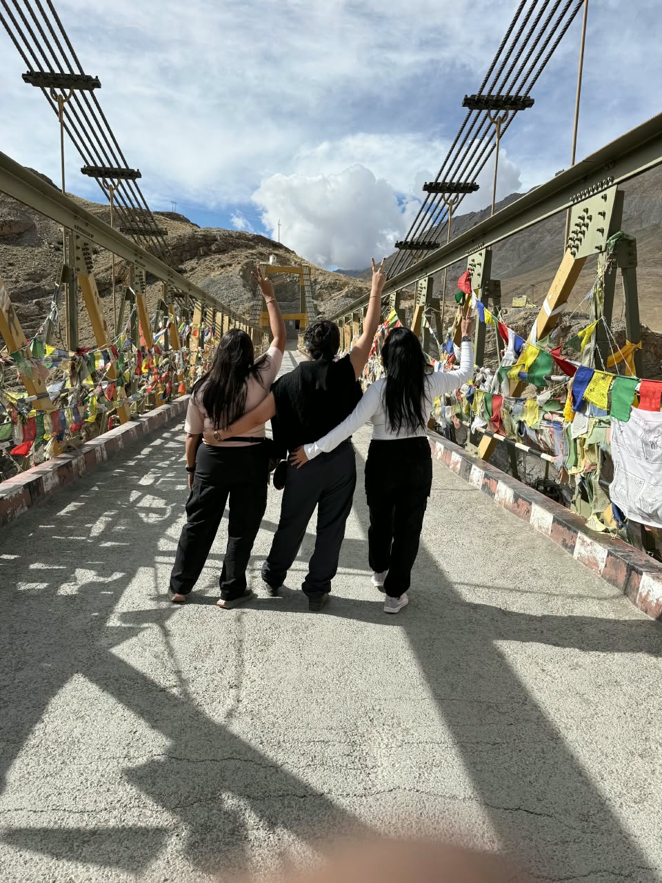 Travellers crossing Chicham Bridge — Spiti
